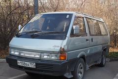 White Nissan Vanette van parked on a city street in Moscow
