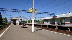 RZD Birulevo-Passazirskaya train station with platform and passenger train