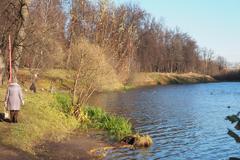 Gertsensky Pond in Moscow with calm water and surrounding trees under clear sky