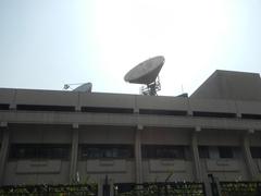 ABS-CBN Broadcasting Center and Eugenio Lopez Jr. Communications Center in Quezon City with Millennium Transmitter Tower and surrounding streets