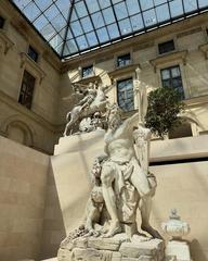 Sculptures displayed in the Louvre Museum showcasing classical art