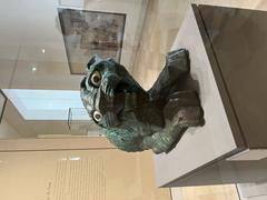 Ancient copper lion statue from 2nd millennium BC displayed at the Louvre Museum