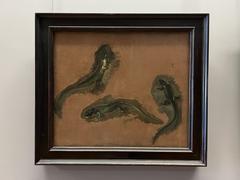 Three studies of a green lizard in natural poses