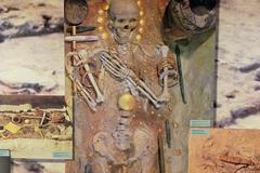 Archaeological view of Varna Necropolis tomb number 43 with artifacts and skeletal remains