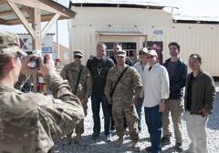 U.S. Army soldiers posing with comedians from the Comics on Duty tour at Bagram Airfield on October 24, 2012