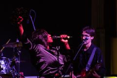 Tanya Trotter of The War and Treaty singing and playing tambourine at La Bella Vista club Aviano Air Base Italy