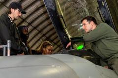 Capt. Carson McKay explaining F-16 Fighting Falcon capabilities to The War and Treaty at Aviano Air Base