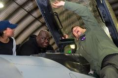 The War and Treaty members with Capt. Carson McKay showcasing F-16 Fighting Falcon at Aviano Air Base