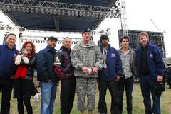 Gary Sinese, Mallory Lewis with Lamb Chop, Tony Stewart, Lt.Gen. Robert W. Cone, Chamillionaire, Nick Jonas, and Dana Carvey show support for soldiers and their families with USO supporters