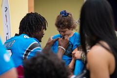 Sam Franklin Jr. with Carolina Panthers, TopCat Cheerleaders and mascot Sir Purr at community outreach event at 2d Cavalry Regiment Dragoon Inn Warrior Restaurant