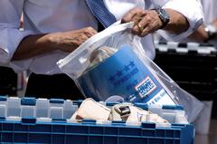 President Obama and Pittsburgh Steelers packing care packages on White House South Lawn
