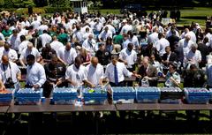 President Obama and Pittsburgh Steelers packing care packages at White House