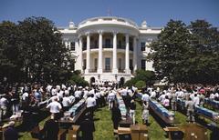President Obama and Pittsburgh Steelers packing care packages on White House South Lawn