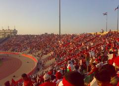 Omani football fans cheering in a crowded stadium during the 19th Gulf Cup of Nations in Muscat