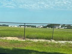 Aerial view of Fernandina Beach Airport from beside the runway with clear skies