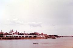 1970s view of river Volkhov and Yaroslav Court arcade from Kremlin pedestrian bridge in Novgorod