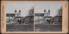 Historic street Ludvisarskaja in Vilnia featuring the Church of the Holy Cross and Bonifrat monastery in vintage stereoscopic view