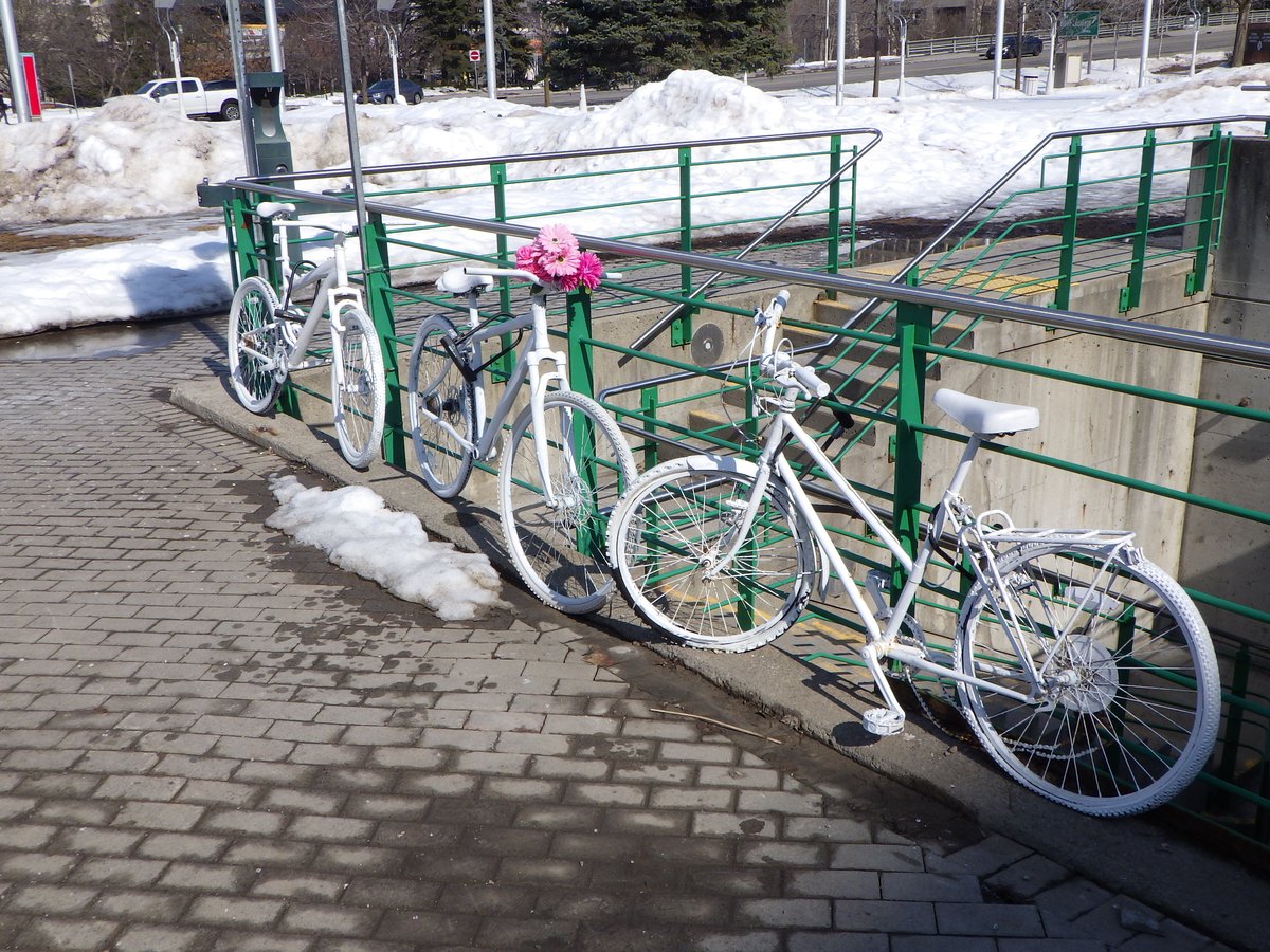 Ghost bike memorials at Ottawa City Hall near the Rink of Dreams