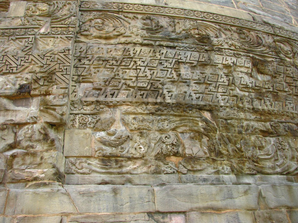 Close-up view of intricate carvings on the wall of Dhamekh Stupa in Sarnath