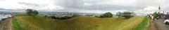Panorama of Mt. Eden crater with surrounding landscape under clear sky