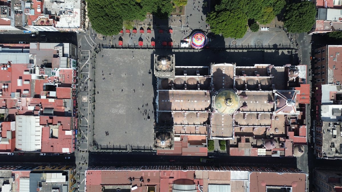 Aerial drone view of Catedral de Puebla showcasing its intricate architecture and surrounding buildings