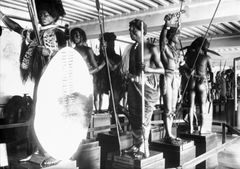 Ethnographic gallery in the Artillery Museum featuring mannequins in dynamic poses wearing traditional costumes