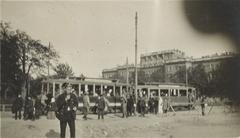 People and trams near St. Michael's Castle in Petrograd with women parading to the Duma and a moving van labeled Furstadtskaya