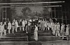 Still from 1924 American comedy film The Great White Way showing choreographer Ned Wayburn coaching Mabel in a dance rehearsal atop New Amsterdam Theatre NYC
