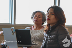 People in a conference room setting during a meeting session