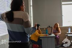 Presenter explaining first session PowerPoint slides