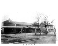 Namba Station during Hankai Railway period with vintage tram and station building