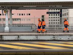 SNCF agents in orange uniforms at Lyon-Part-Dieu train station