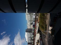 View of railway tracks and Paul Bert street from a building on Rue de la Villette with part of the south column of a car rental parking