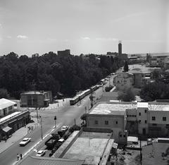 Intersection of Herzl and Rothschild streets in Rishon LeZion with Carmel wineries in the background
