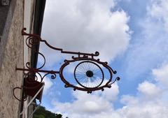 Vintage bicycle shop sign in Dinan, France