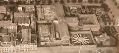 Aerial view of old Melbourne Gaol with Governor's residence and exercise yard in 1922 showing Bowen Street before Royal Melbourne Institute of Technology construction