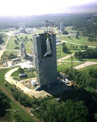 Aerial view of the 1978 Shuttle Enterprise being lifted into Marshall's Dynamic Test Stand for ground vibration tests