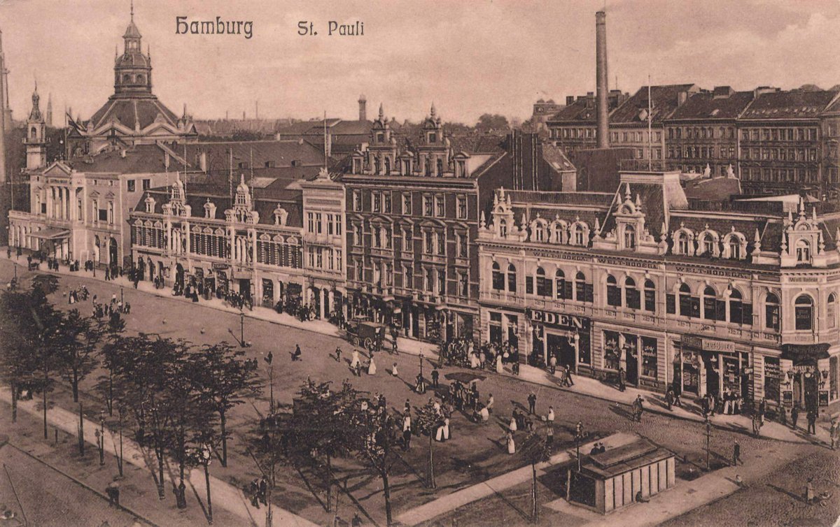 Historic black and white photograph of Spielbudenplatz in Hamburg from 1900 showing old buildings and street scene