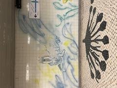Colorful azulejo tile panels by Júlio Resende at Jardim Zoológico metro station in Lisbon