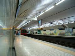 Lisbon Jardim Zoológico Metro Station platform with trains and passengers