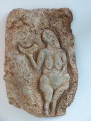 Replica of Venus figure from Laussel holding a horn symbolizing abundance or moon phases