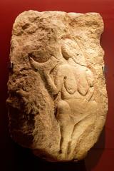 Venus of Laussel prehistoric carved female figurine holding a bison horn