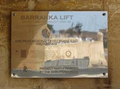 Sign at Upper Barrakka Lift reflecting surroundings like a mirror in Valletta Malta