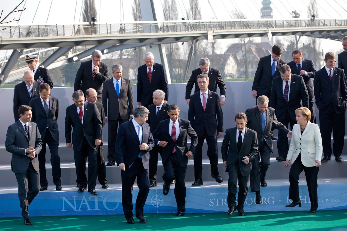 President Barack Obama, NATO Secretary General Jaap de Hoop Scheffer and NATO leaders stepping down from photo platform at 2009 NATO Strasbourg–Kehl summit