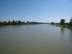 Scenic view of the Rhine River between Strasbourg and Kehl in July 2007 with lush greenery along the riverbanks