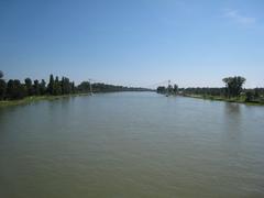 Scenic view of the Rhine River between Strasbourg and Kehl in July 2007 with lush greenery and calm water