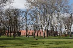 Park inside the Warsaw Citadel with trees and walking paths in spring