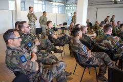 Military personnel participating in joint air-ground integration training exercise