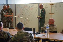 Military personnel conducting Joint Air-Ground Integration Center training in Lille, France
