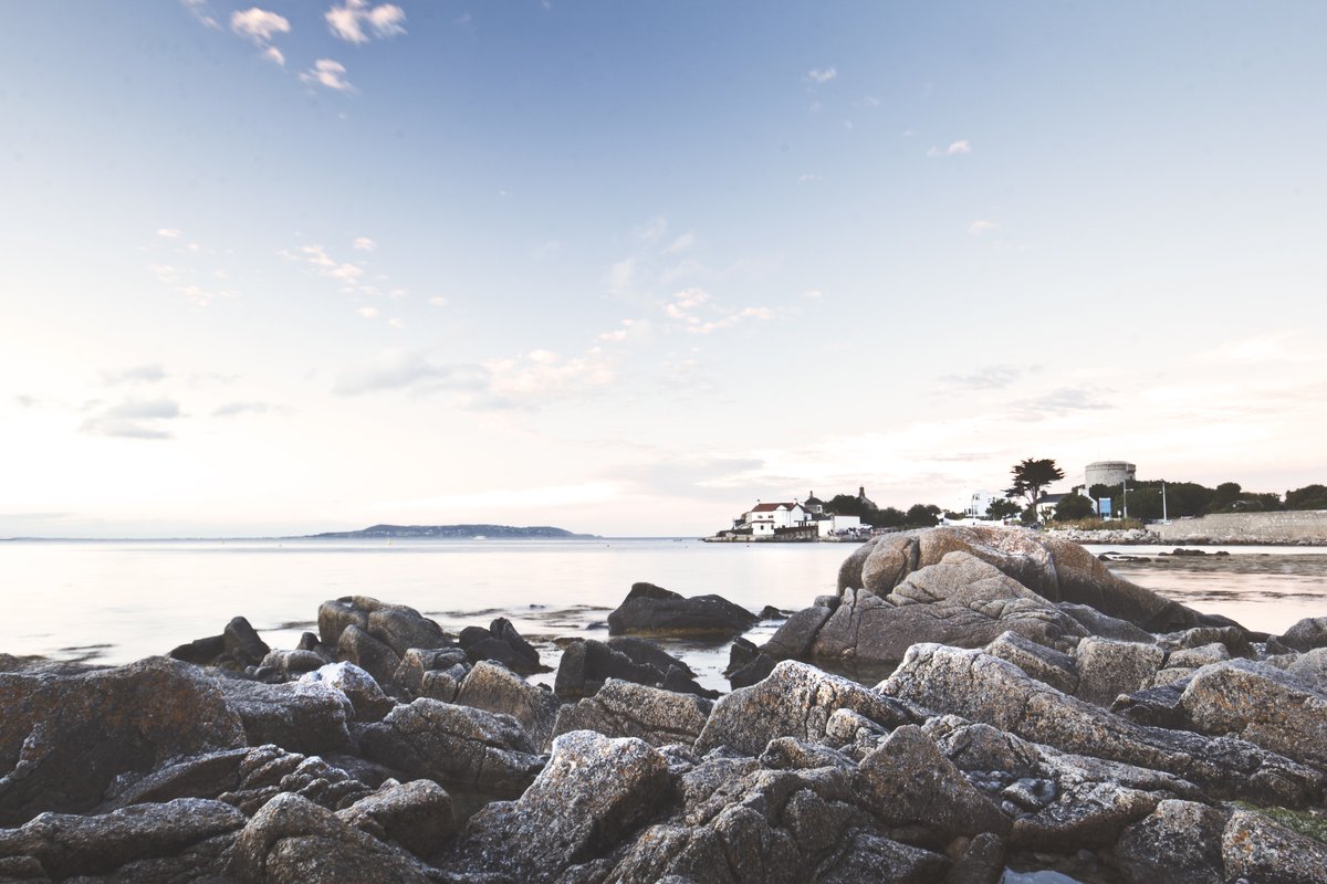 Rocky shore at Dún Laoghaire, Dublin, Ireland under a cloudy sky